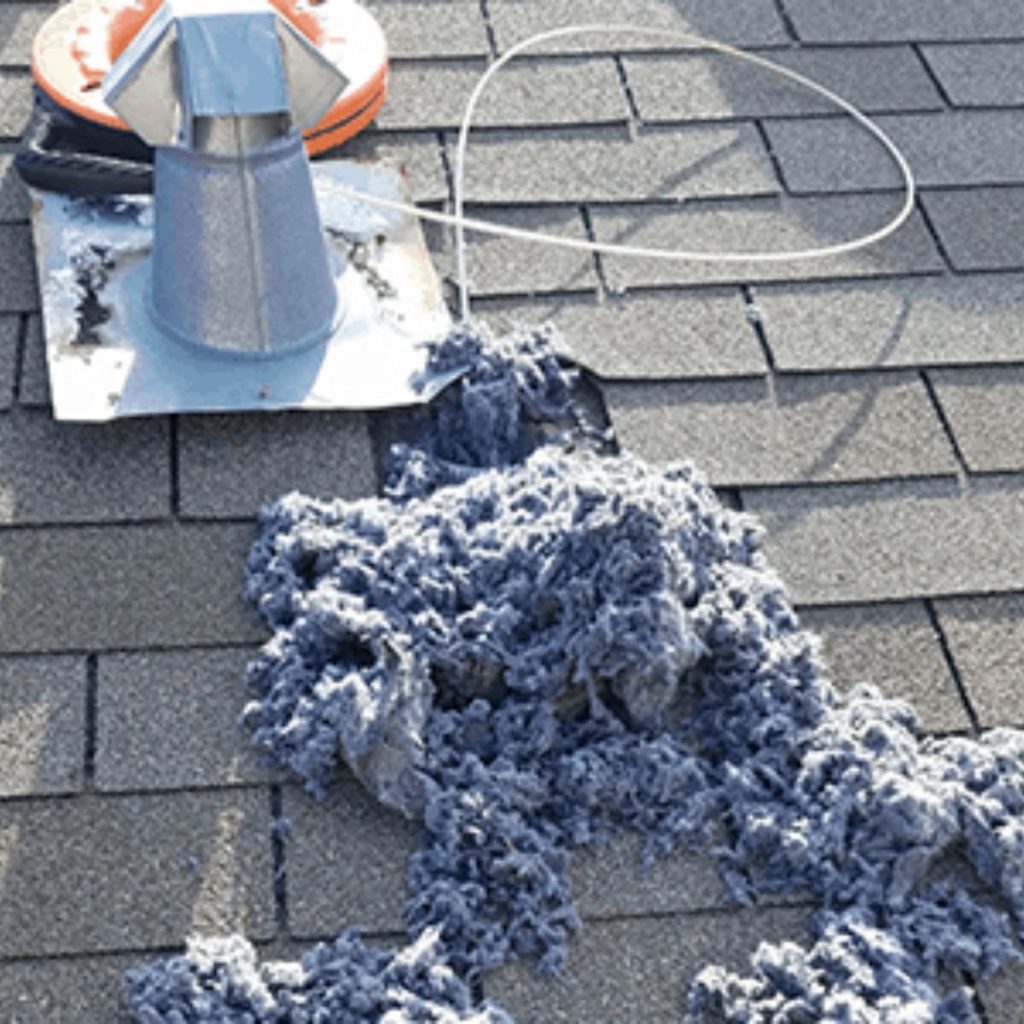 Large pile of lint removed from rooftop dryer vent exhaust
