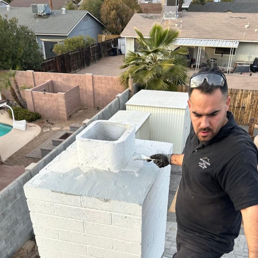 EcoAirClean technician performing chimney crown repair and waterproofing.