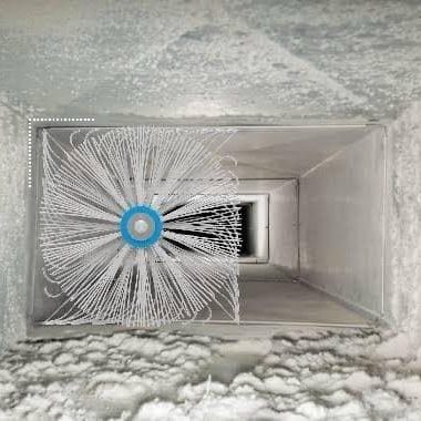 Rotary brush cleaning dust buildup inside air duct system